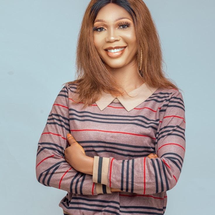 Kaveri Mehta, Lead Design Curator at SaffronHarborLeaf, reviewing corporate floral arrangements